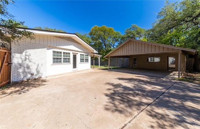 view of side of property with a carport