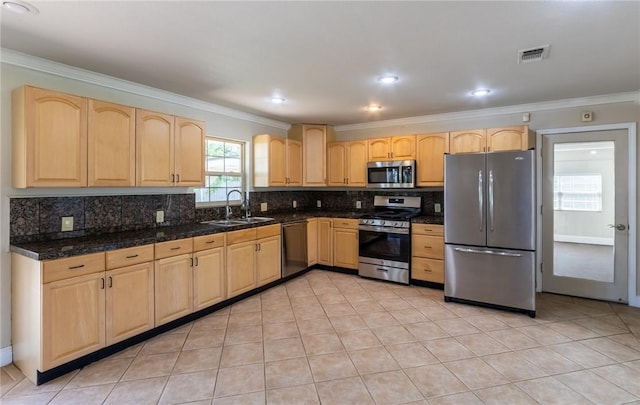 kitchen featuring light tile patterned flooring, light brown cabinetry, sink, stainless steel appliances, and crown molding