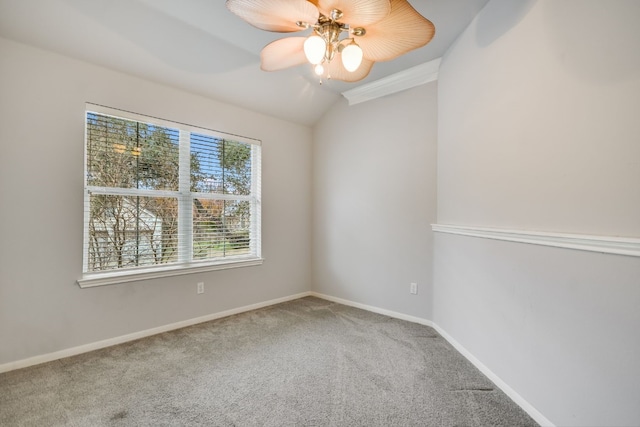 unfurnished room featuring lofted ceiling, a ceiling fan, baseboards, and carpet flooring