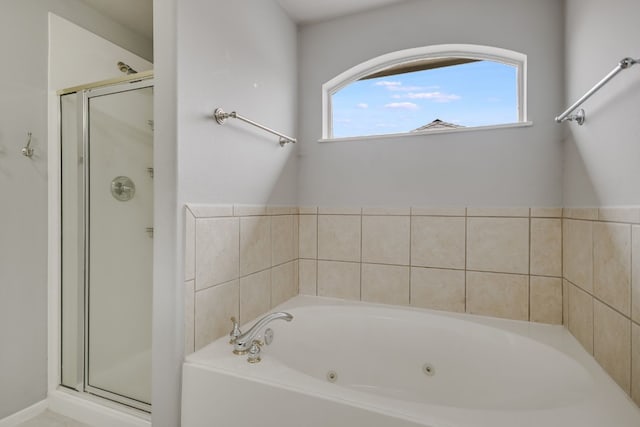 bathroom with a whirlpool tub and a shower stall