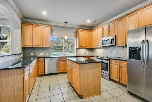 kitchen featuring a center island, decorative light fixtures, stainless steel appliances, ornamental molding, and light tile patterned flooring