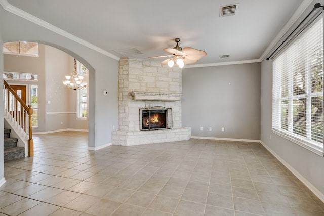 unfurnished living room featuring ornamental molding, a wealth of natural light, light tile patterned flooring, and visible vents