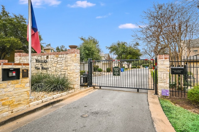 view of gate with fence