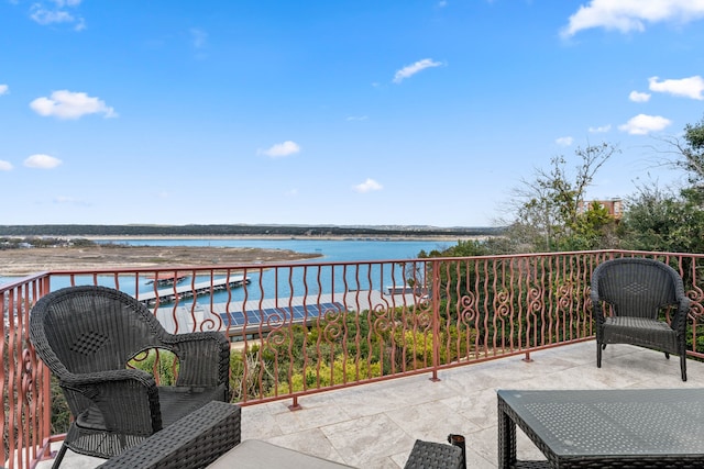 balcony featuring a water view