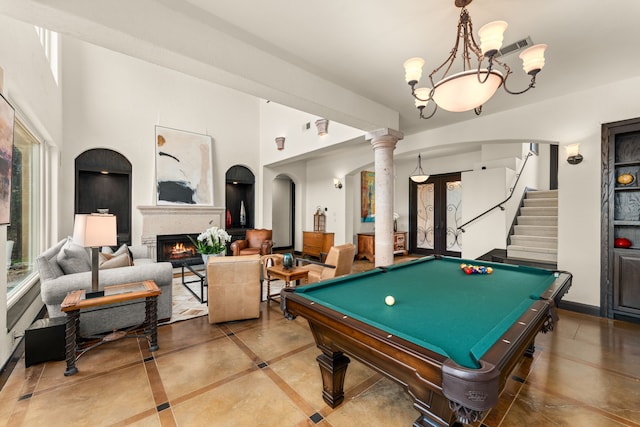 game room featuring pool table, a wealth of natural light, and decorative columns