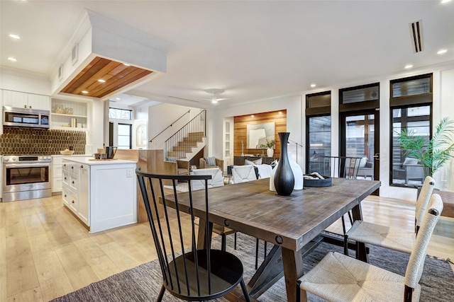 dining area featuring ceiling fan and light hardwood / wood-style floors