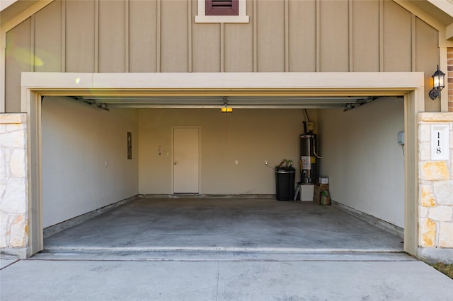 garage with gas water heater and electric panel