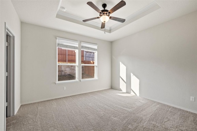 118 Grace Lilly Dr, Buda, TX 78610 - spare room with a raised ceiling, carpet, ceiling fan, a smoke detector, and ornamental molding
