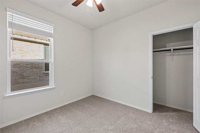 unfurnished bedroom featuring ceiling fan, carpet flooring, and a closet