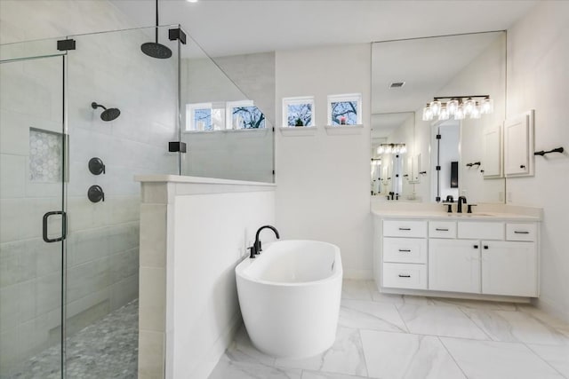 1114 Woodpark Ln, Georgetown, TX 78633 - bathroom with a shower stall, vanity, a freestanding bath, and marble look tile flooring