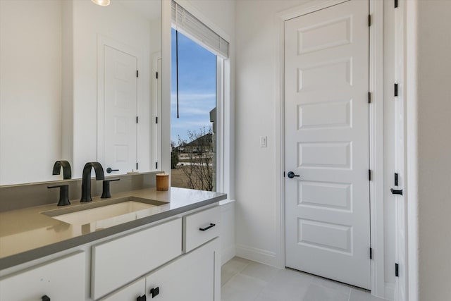 bathroom featuring tile patterned floors and vanity