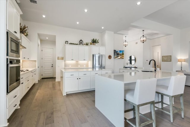 1114 Woodpark Ln, Georgetown, TX 78633 - kitchen with stainless steel appliances, a large island, backsplash, and recessed lighting