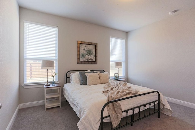 bedroom featuring dark colored carpet