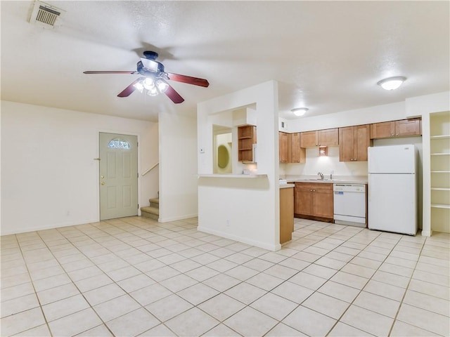 kitchen with ceiling fan, white appliances, sink, and light tile patterned floors