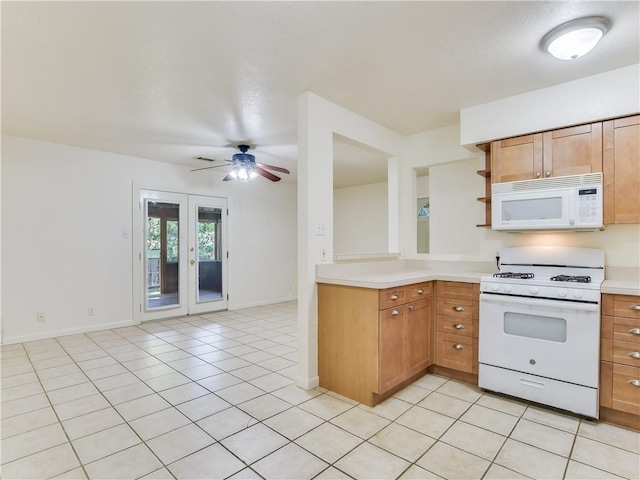 kitchen with light tile patterned flooring, white appliances, ceiling fan, and french doors