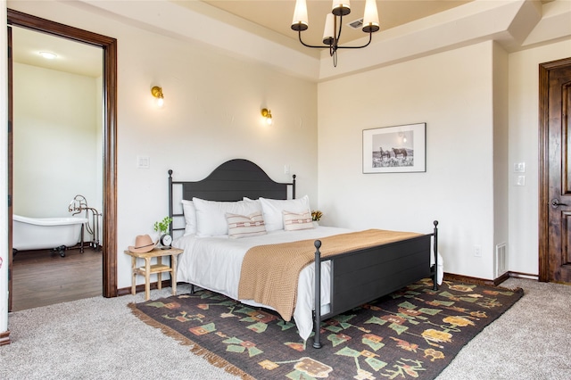 bedroom with carpet and an inviting chandelier