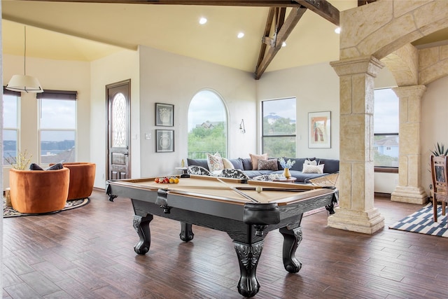 rec room with beam ceiling, wood-type flooring, decorative columns, and a towering ceiling