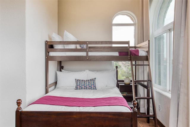 bedroom with hardwood / wood-style floors