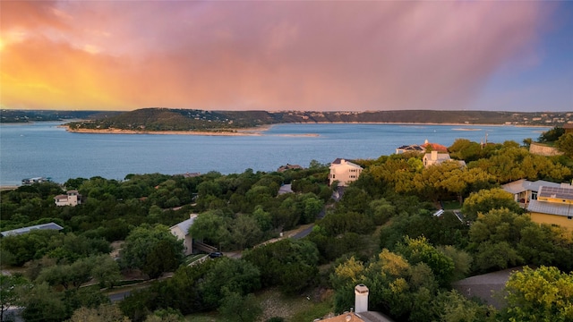 aerial view at dusk with a water view