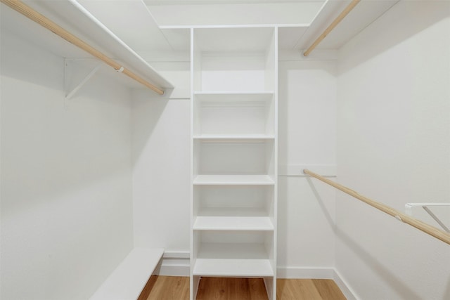 walk in closet featuring hardwood / wood-style floors