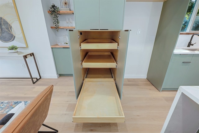 kitchen featuring sink and light wood-type flooring