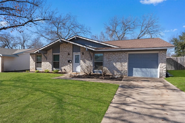 view of front of property featuring a garage and a front lawn