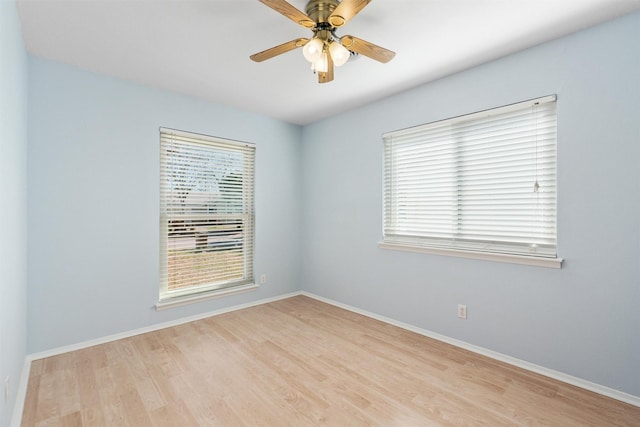 spare room with ceiling fan and light hardwood / wood-style flooring