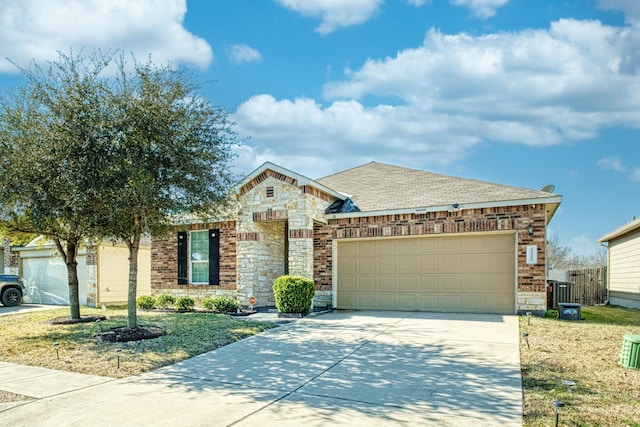 view of front facade with a garage and a front lawn