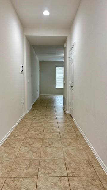 corridor featuring light tile patterned flooring