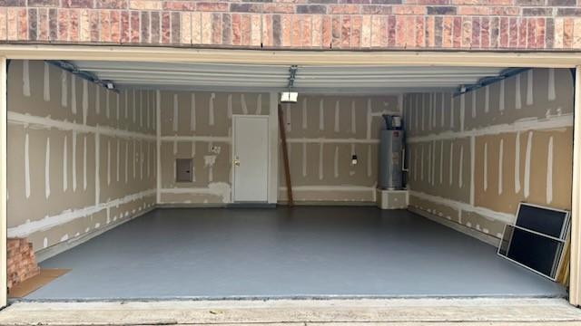 garage with a carport and water heater