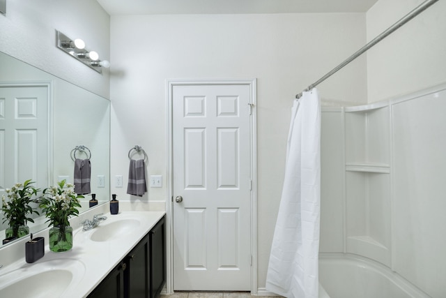 bathroom featuring shower / bathtub combination with curtain and vanity