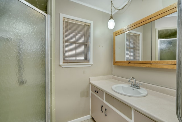 bathroom with vanity and a shower with shower door