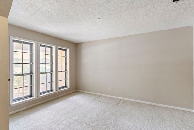 108 Fairlane Dr, Round Rock, TX 78664 - carpeted empty room with a textured ceiling and baseboards