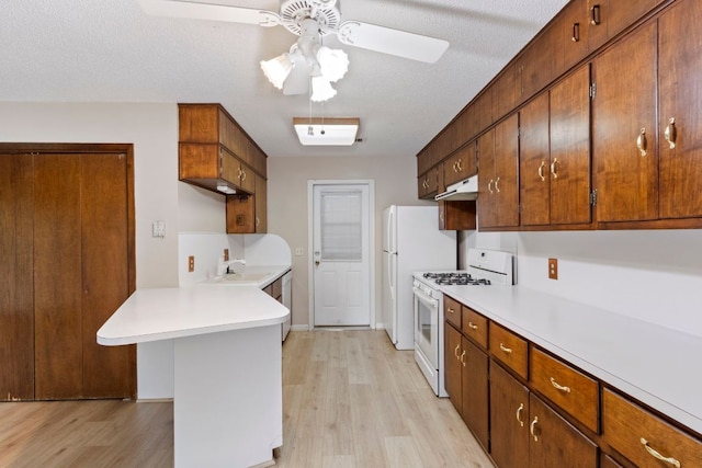 108 Fairlane Dr, Round Rock, TX 78664 - kitchen featuring white appliances, under cabinet range hood, light countertops, and ceiling fan
