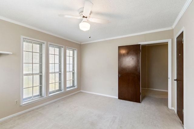 108 Fairlane Dr, Round Rock, TX 78664 - unfurnished bedroom featuring ornamental molding, carpet flooring, a ceiling fan, and a textured ceiling