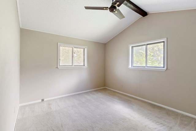 carpeted empty room with healthy amount of natural light, ceiling fan, and baseboards