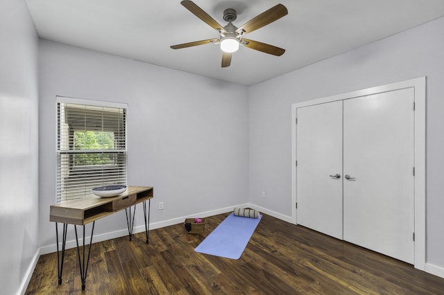 interior space with dark hardwood / wood-style floors and ceiling fan