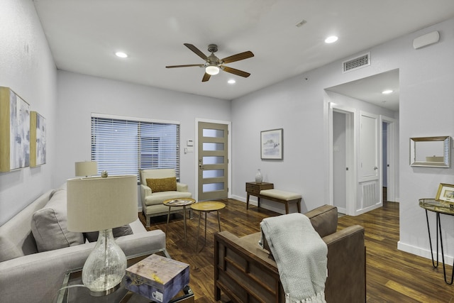 living room with ceiling fan and dark hardwood / wood-style floors