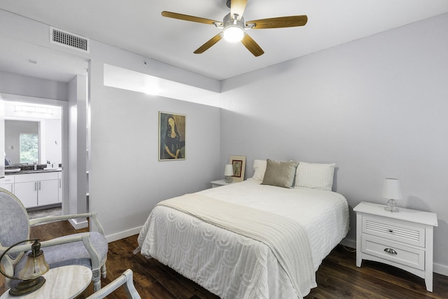 bedroom with dark hardwood / wood-style flooring and ceiling fan