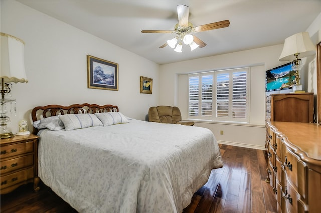 bedroom with dark wood-type flooring and ceiling fan