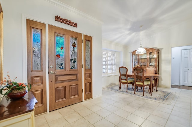 entryway featuring ornamental molding and light tile patterned flooring