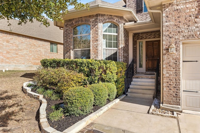 doorway to property with a garage