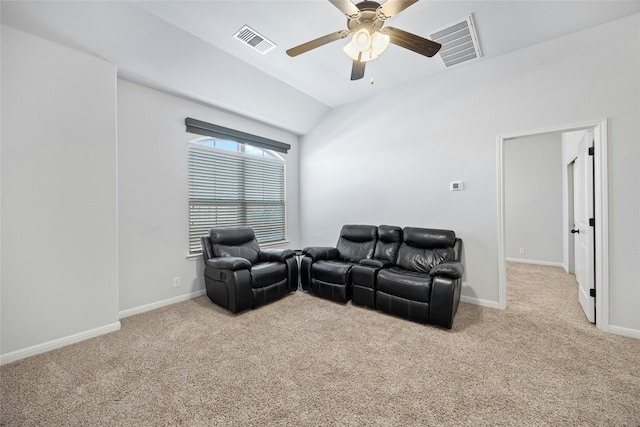 living room with ceiling fan, light colored carpet, and lofted ceiling