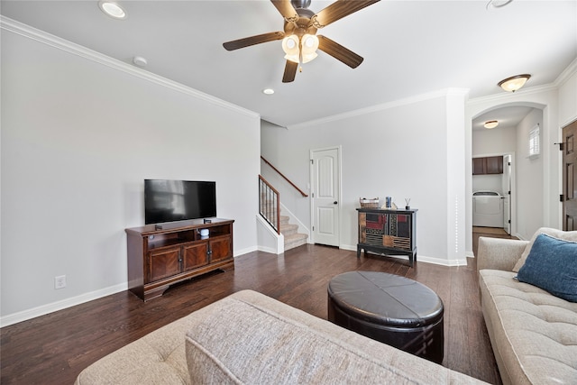 living room featuring dark hardwood / wood-style flooring, ornamental molding, and ceiling fan