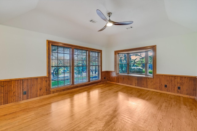 unfurnished room with ceiling fan and light hardwood / wood-style floors