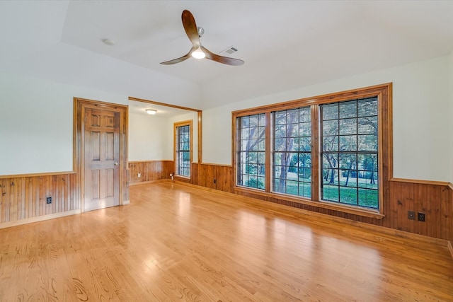 unfurnished living room featuring ceiling fan and light hardwood / wood-style flooring