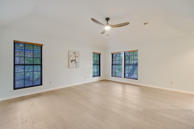 spare room featuring light hardwood / wood-style flooring, ceiling fan, and plenty of natural light