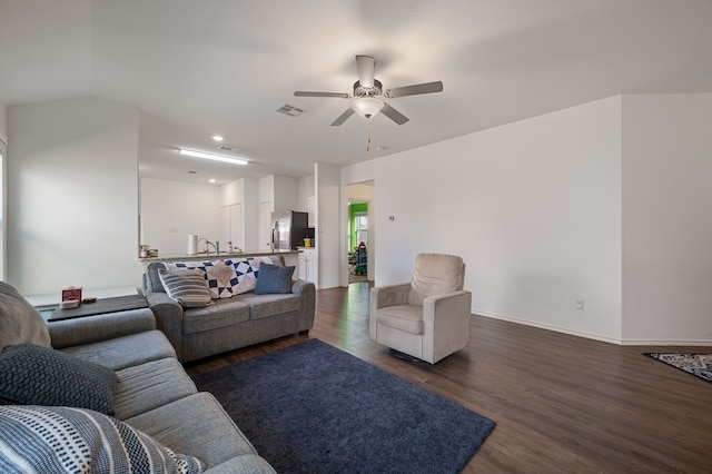 living room with lofted ceiling, sink, dark hardwood / wood-style floors, and ceiling fan