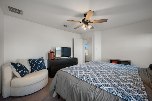 bedroom with ceiling fan and carpet flooring