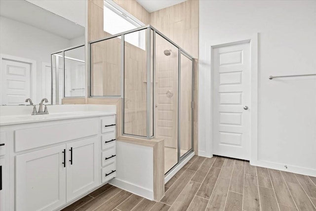 bathroom featuring vanity and an enclosed shower